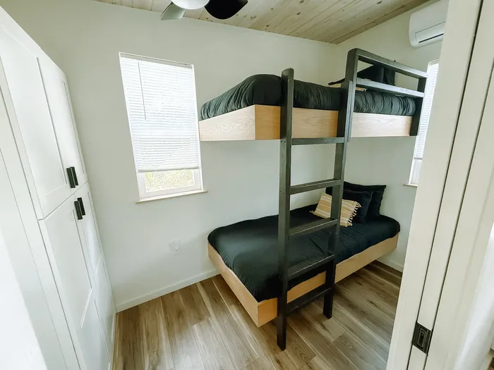 Bunk beds in the surf camp tiny home, sleeping space for campers